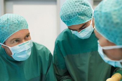 Physicians in Surgery --- Image by © moodboard/Corbis